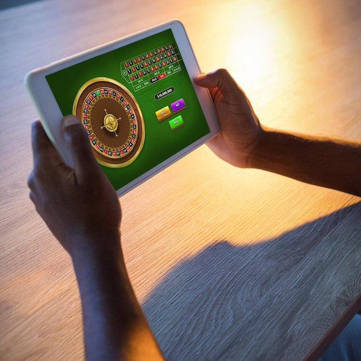 Antarmuka aplikasi mobile toto gp menampilkan meja live dealer dan pilihan taruhan olahraga